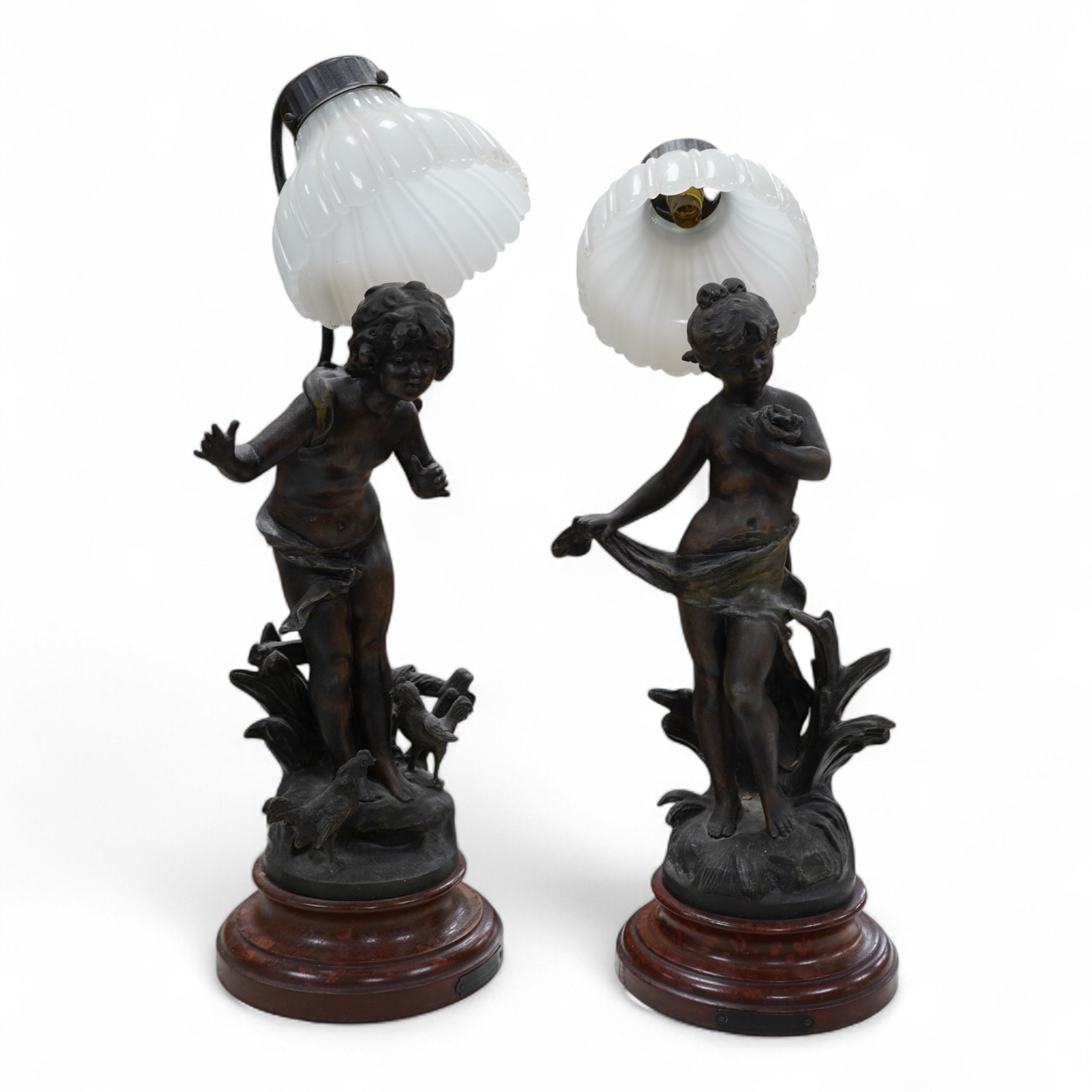 A pair of Art Nouveau style bronzed lady table lamps and glass shades, 48cm including shades and sands